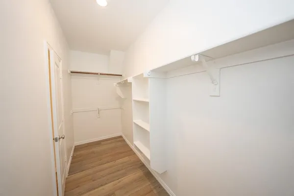 a view of an empty walk in closet