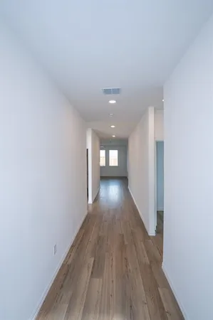 a view of gallery with wooden floor