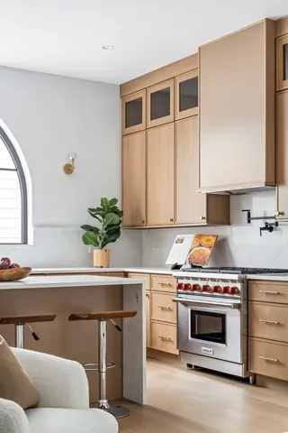 a kitchen with a sink and a stove top oven