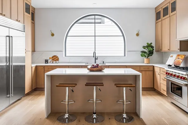 a kitchen with stainless steel appliances granite countertop a stove and a sink