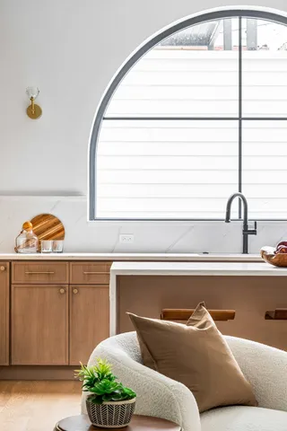 a view of a kitchen with stainless steel appliances granite countertop a stove a sink dishwasher and a refrigerator with wooden floor