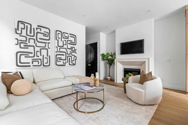 a spacious bedroom with a bed and a large window