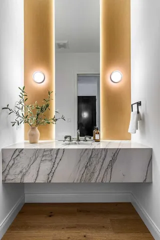 a bedroom with a bed and a potted plant