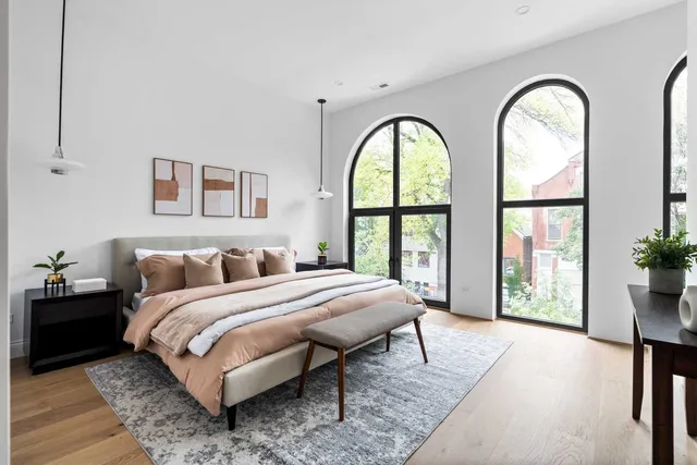 a bathroom with a double vanity sink mirror and shower