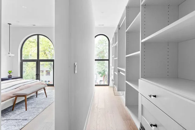 a bedroom with bed and a window