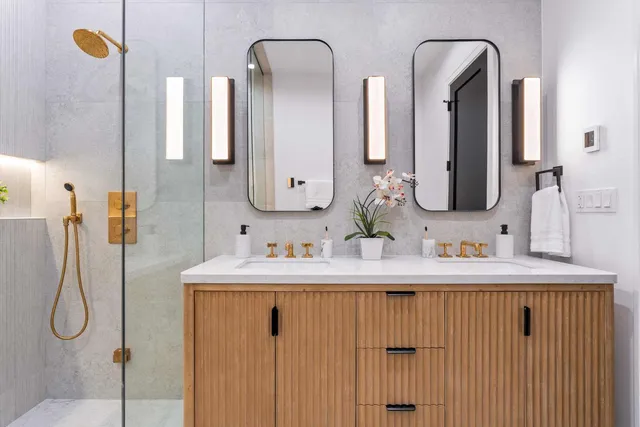 a kitchen with stainless steel appliances granite countertop a refrigerator