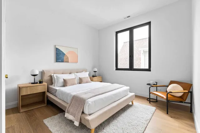 a living room with furniture and stairs