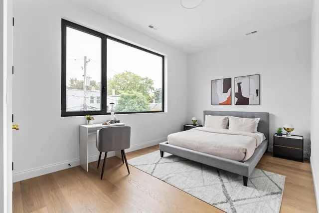 a bedroom with a bed and window