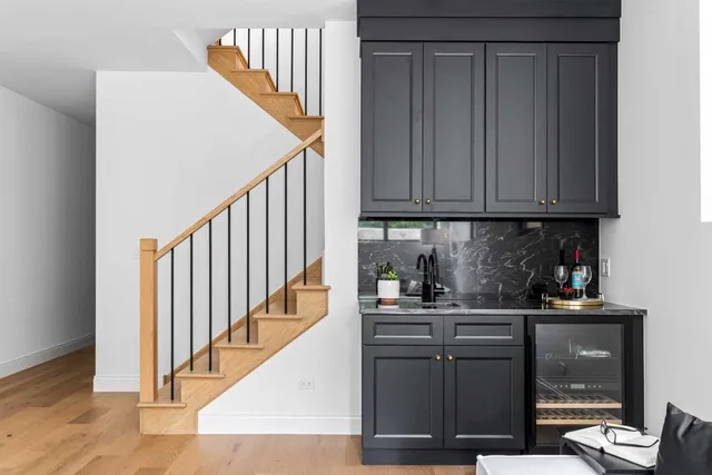a view of a patio with table and chairs and wooden floor