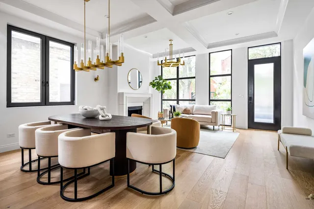 a living room with furniture a window and a fireplace