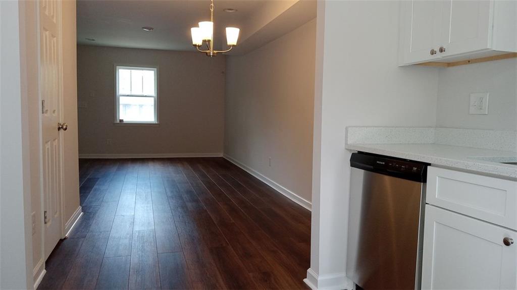 2156 Park Terrace, Unit 3 Atlanta, GA 30337 - Photo 11 of 29 wooden floor in an empty room with a window