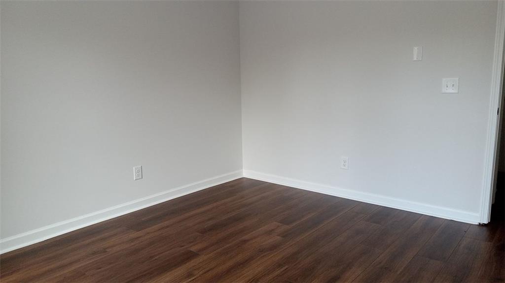 2156 Park Terrace, Unit 3 Atlanta, GA 30337 - Photo 21 of 29 a view of an empty room with wooden floor