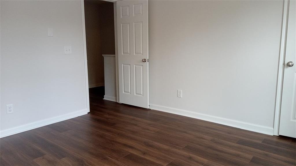 2156 Park Terrace, Unit 3 Atlanta, GA 30337 - Photo 22 of 29 a view of an empty room with wooden floor