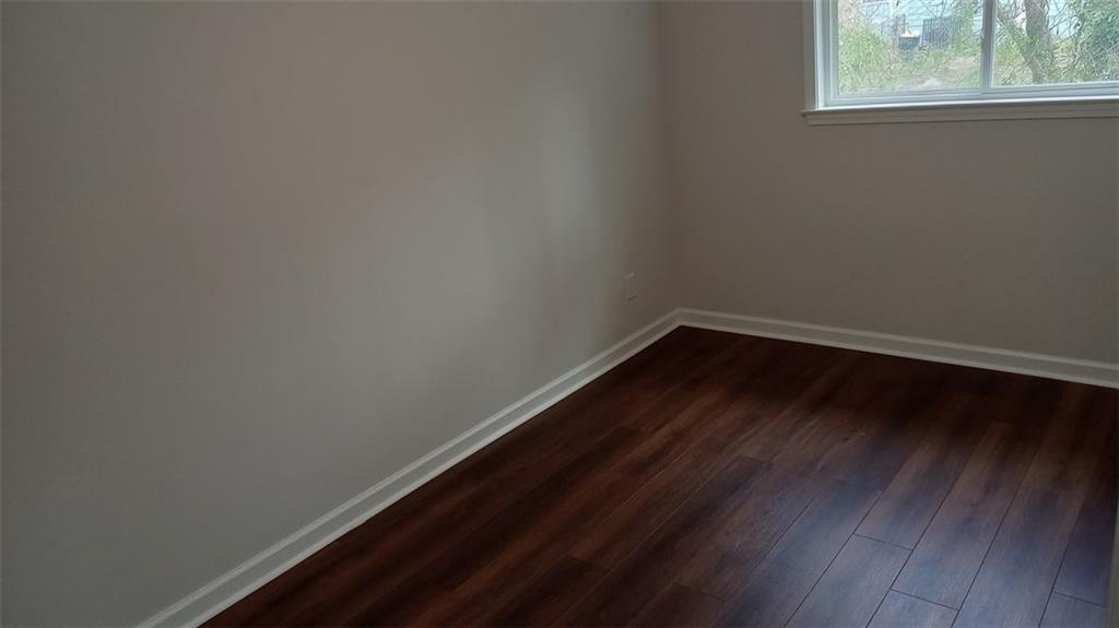 2156 Park Terrace, Unit 3 Atlanta, GA 30337 - Photo 25 of 29 a view of a small space with wooden floor and windows