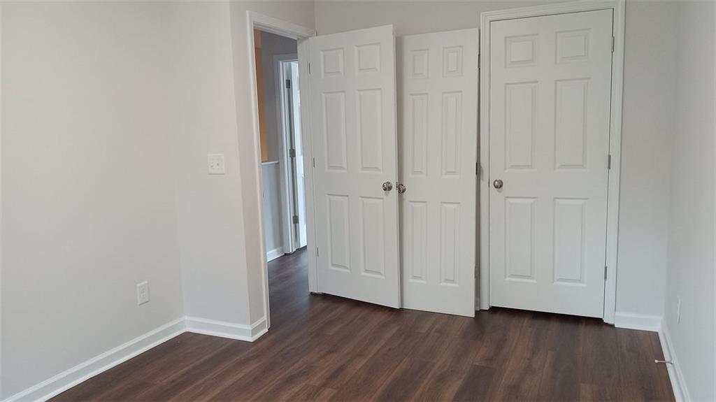 2156 Park Terrace, Unit 3 Atlanta, GA 30337 - Photo 26 of 29 a view of an empty room with wooden floor