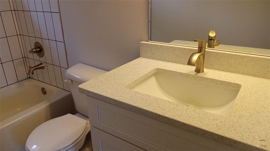 2156 Park Terrace, Unit 3 Atlanta, GA 30337 - Photo 27 of 29 a bathroom with a sink and toilet
