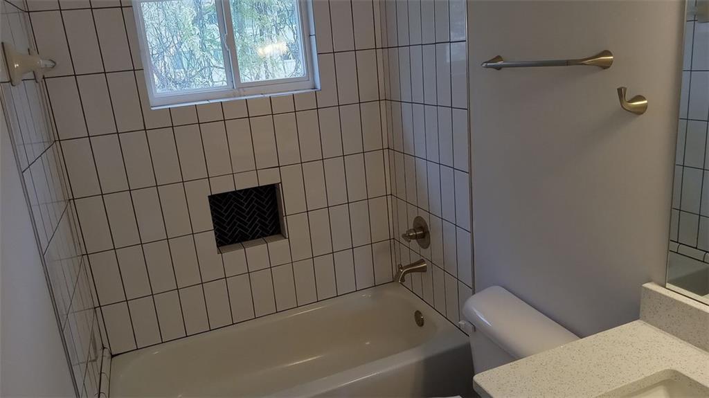 2156 Park Terrace, Unit 3 Atlanta, GA 30337 - Photo 29 of 29 a bathroom with a toilet and a bathtub