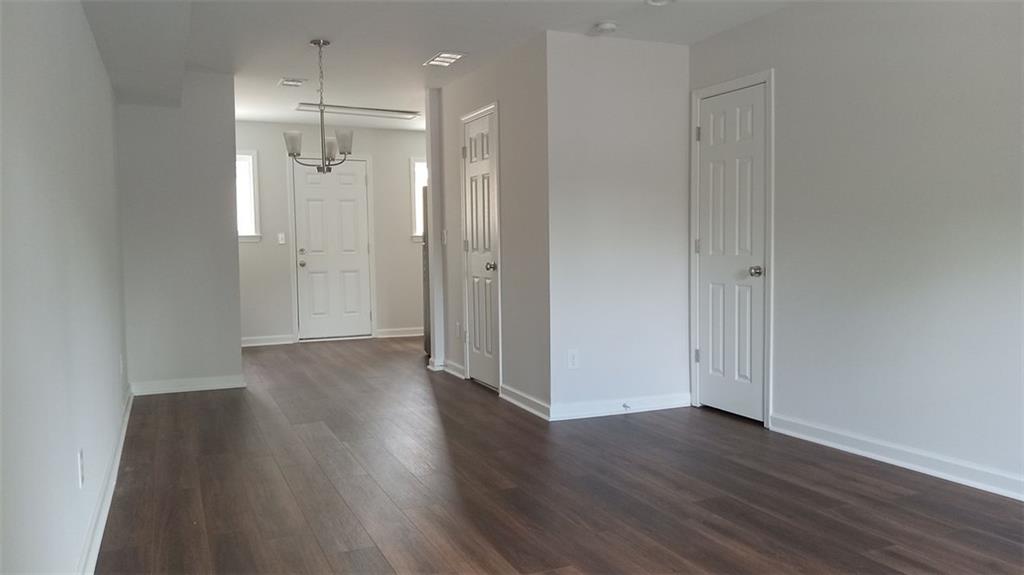 2156 Park Terrace, Unit 3 Atlanta, GA 30337 - Photo 5 of 29 a view of a hallway with wooden floor