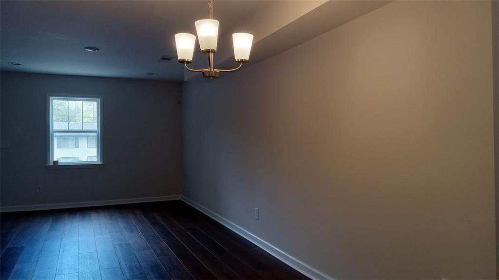 2156 Park Terrace, Unit 3 Atlanta, GA 30337 - Photo 6 of 29 wooden floor in an empty room with a window
