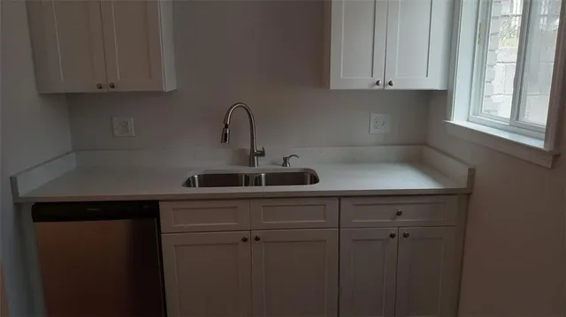 a view of cabinets with wooden floor
