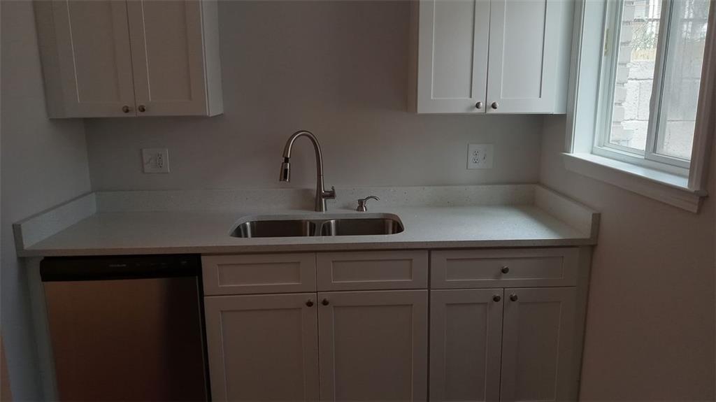 2156 Park Terrace, Unit 3 Atlanta, GA 30337 - Photo 7 of 29 a kitchen with a sink cabinets and a window
