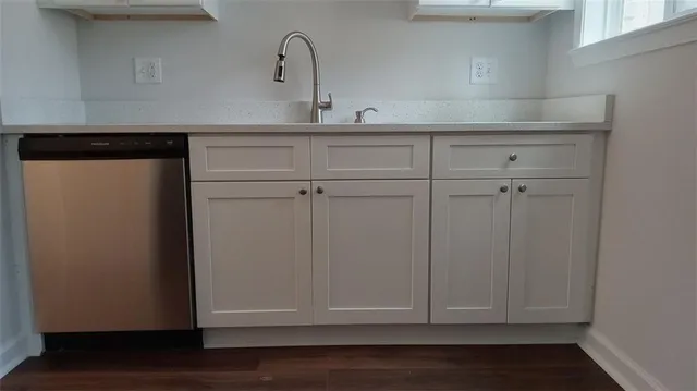 a kitchen with a stove and a microwave