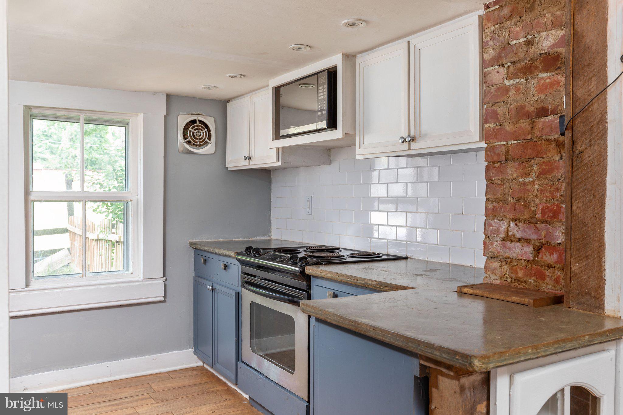 7443 Keith Road Warrenton, VA 20186 - Photo 15 of 44 Kitchen with concrete countertops