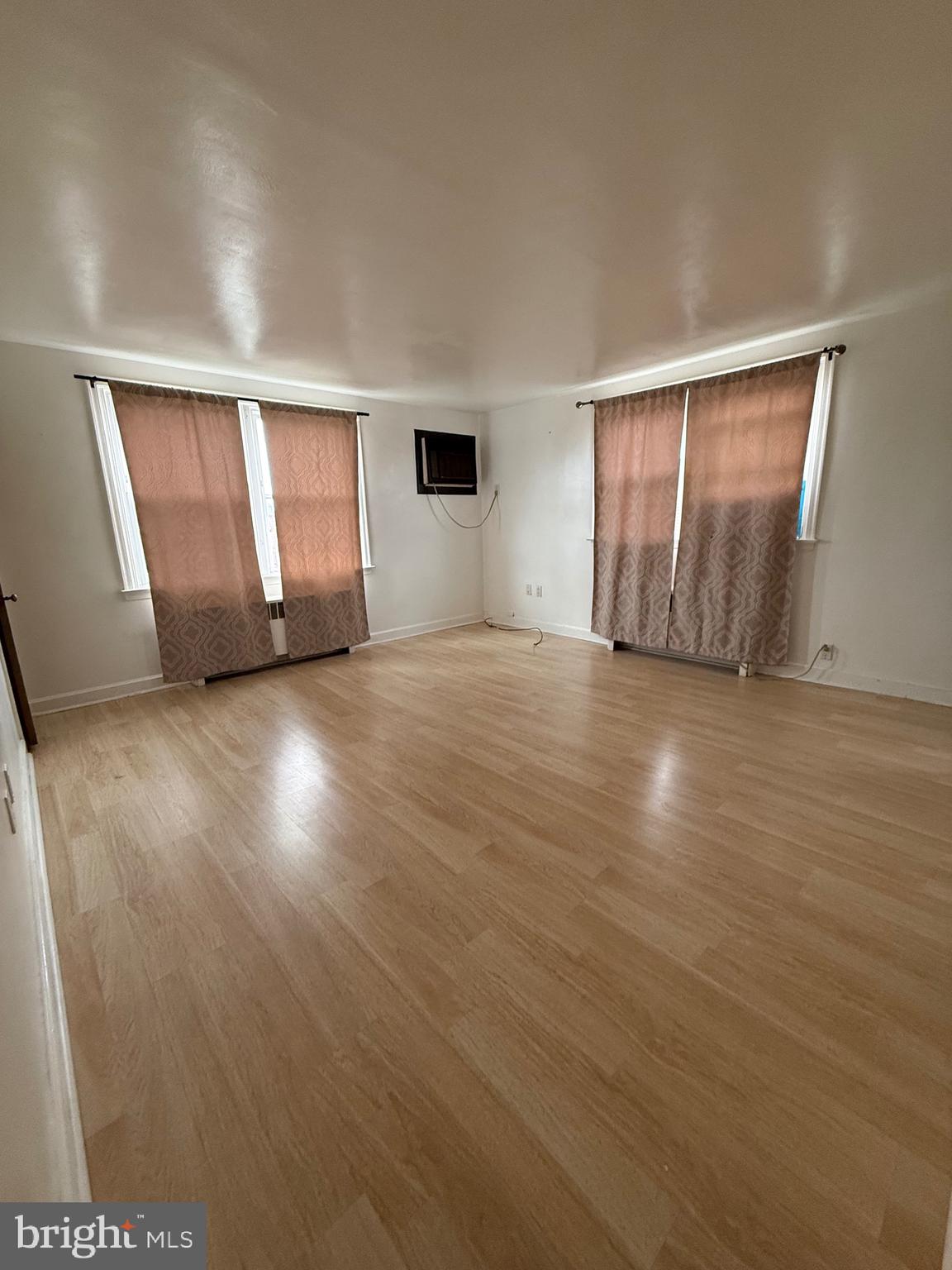 3220 Guilford Street Philadelphia, PA 19136 - Photo 12 of 20 an empty room with wooden floor and windows