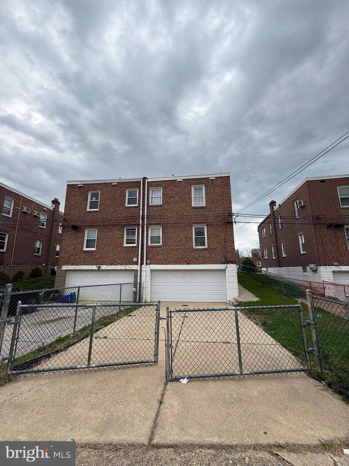 3220 Guilford Street Philadelphia, PA 19136 - Photo 2 of 20 a view of a brick house next to a yard
