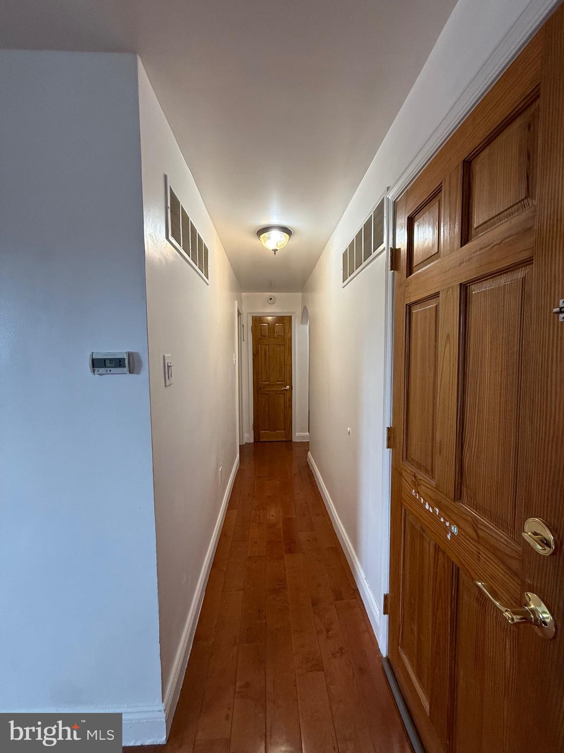 3220 Guilford Street Philadelphia, PA 19136 - Photo 6 of 20 a view of a hallway with wooden floor and staircase