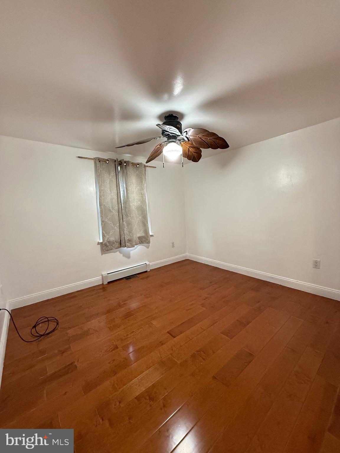 3220 Guilford Street Philadelphia, PA 19136 - Photo 7 of 20 an empty room with a ceiling fan and window