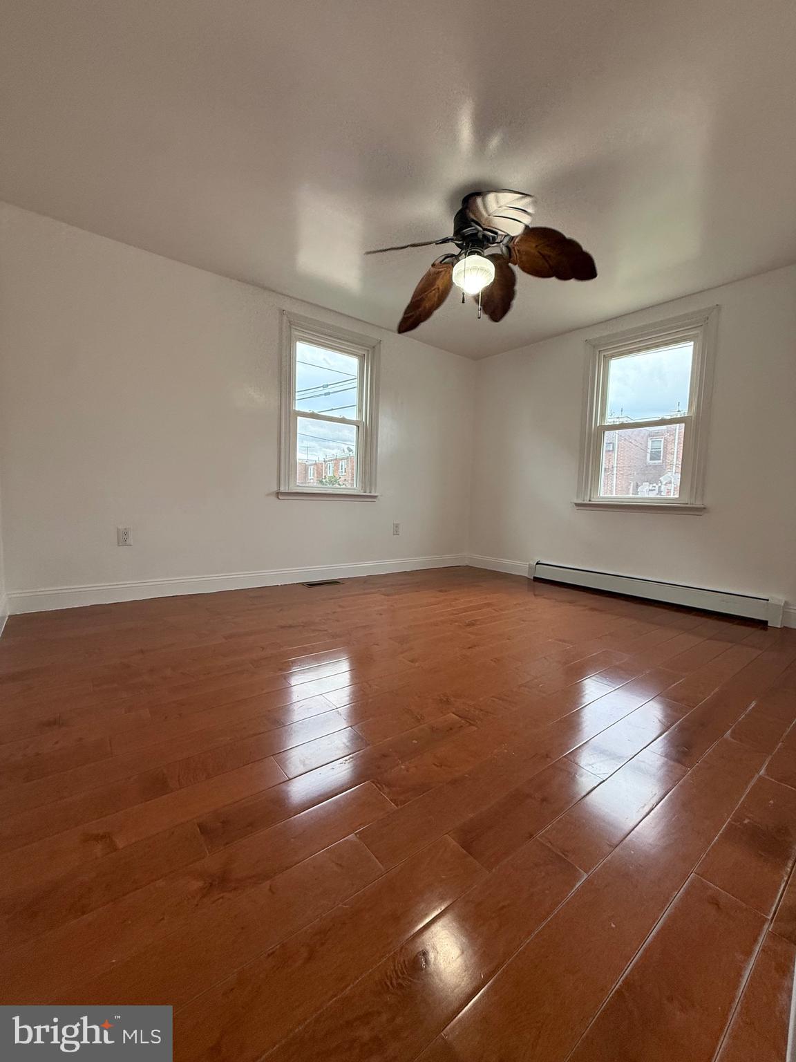 3220 Guilford Street Philadelphia, PA 19136 - Photo 8 of 20 an empty room with wooden floor and windows