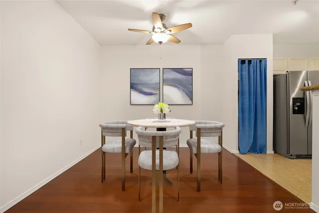 a view of a room with a ceiling fan