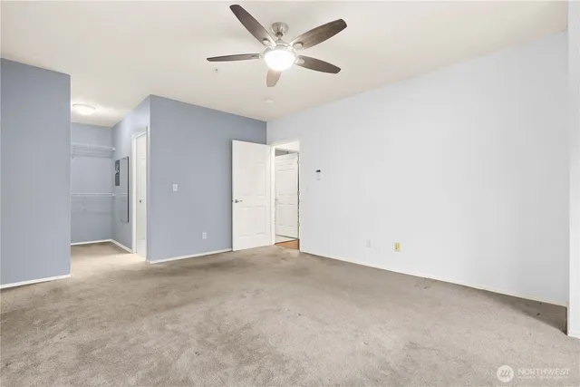 a view of a bathroom with a toilet and a shower