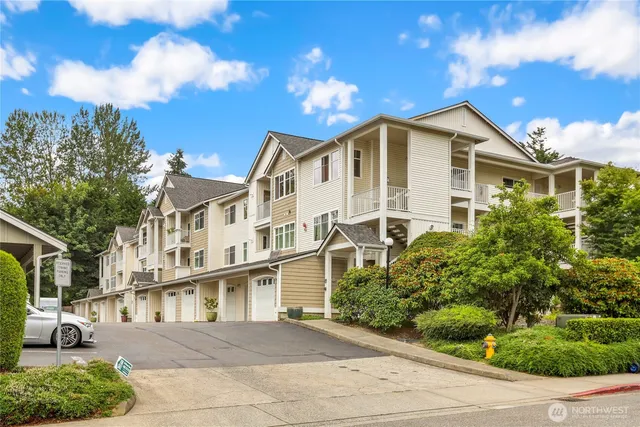 a aerial view of a house with a yard and potted plants