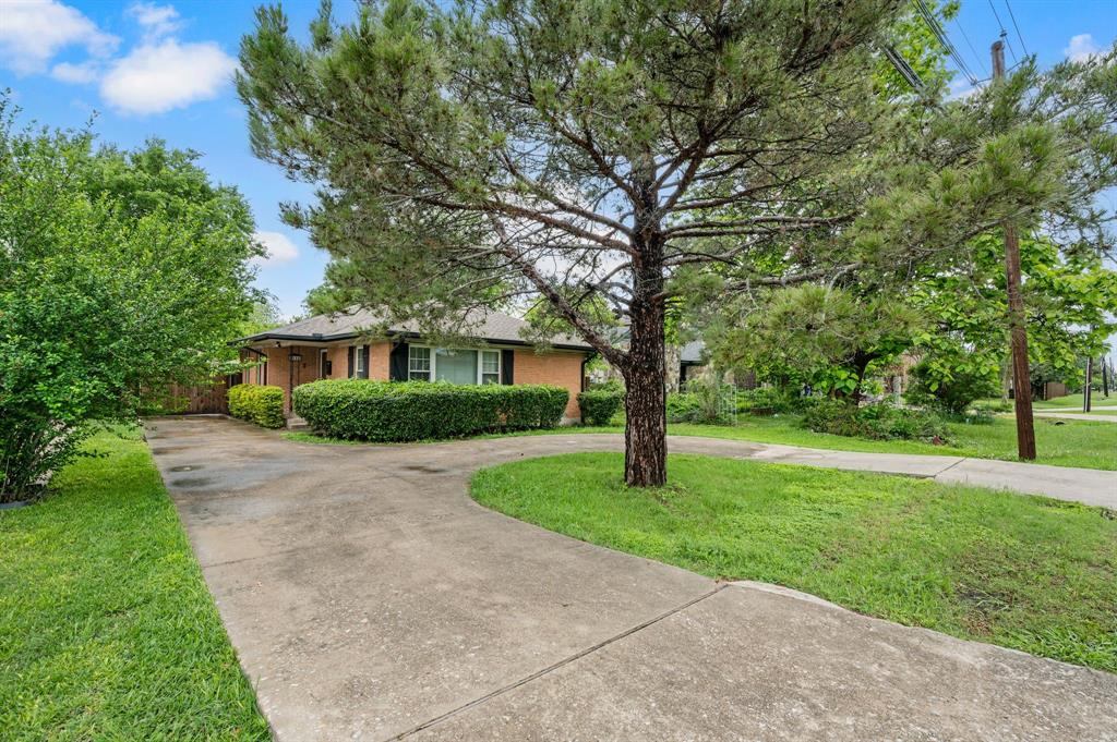 6644 Fisher Road Dallas, TX 75214 - Photo 2 of 21 a front view of a house with a yard