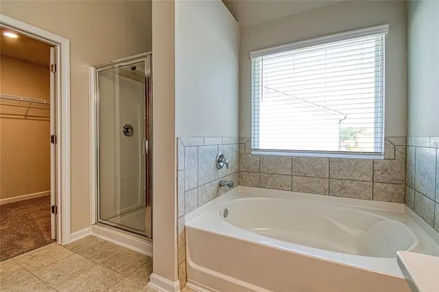 a white bath tub sitting next to a window