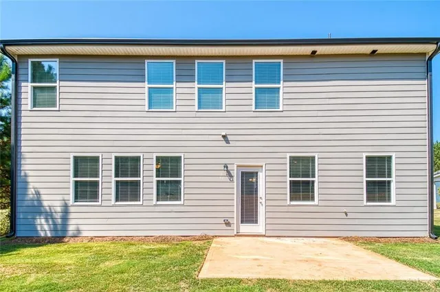 a view of a house with a small yard