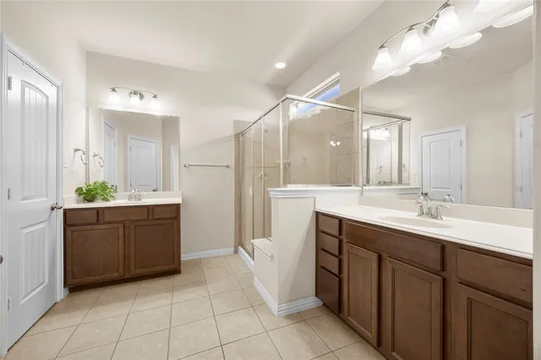 a bathroom with a sink vanity and a mirror