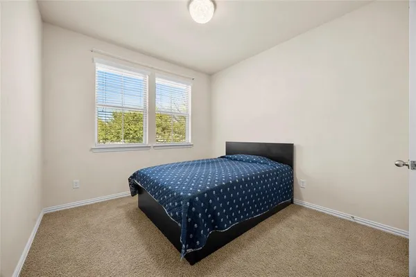 a bathroom with a double vanity sink mirror and toilet