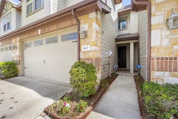 a view of a pathway both side of the house