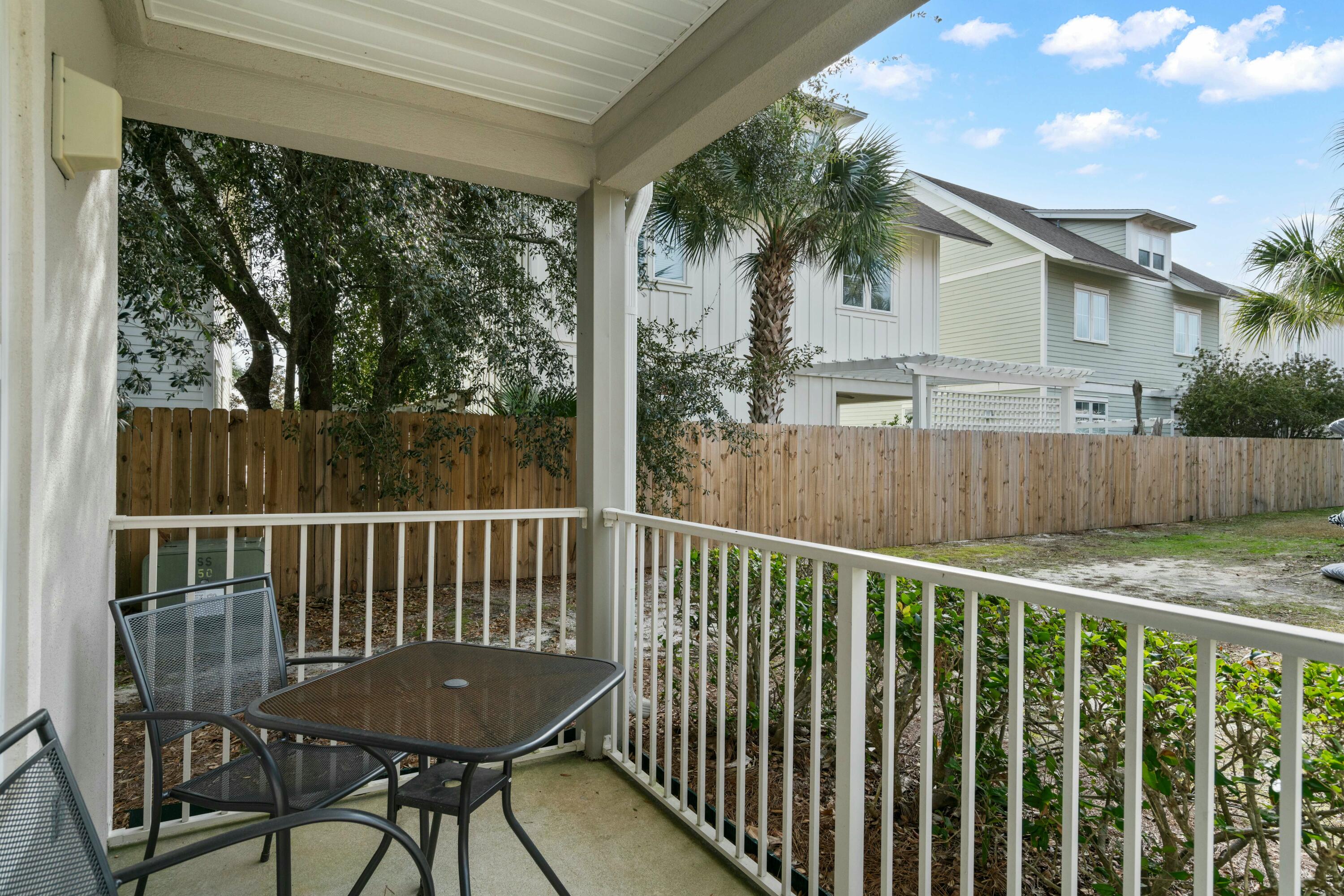 82 Sugar Sand Lane, Unit C1 Santa Rosa Beach, FL 32459 - Photo 15 of 29 a view of a chair and table in the balcony