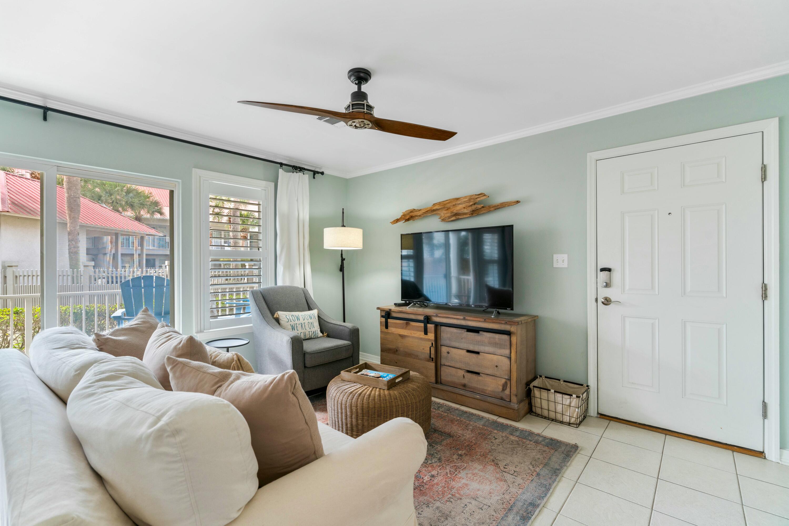 82 Sugar Sand Lane, Unit C1 Santa Rosa Beach, FL 32459 - Photo 2 of 29 a living room with furniture and a flat screen tv