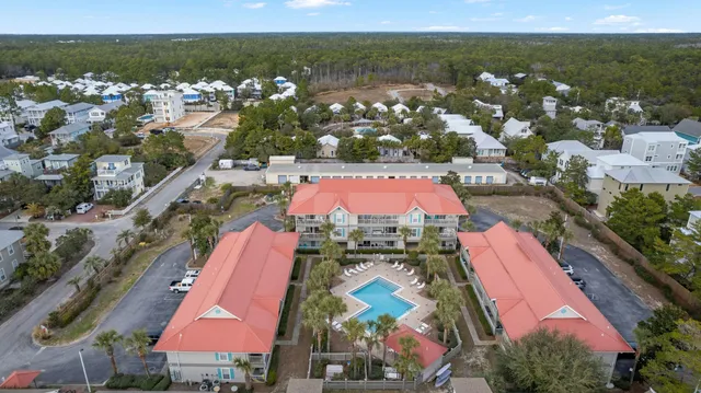 an aerial view of residential houses with outdoor space