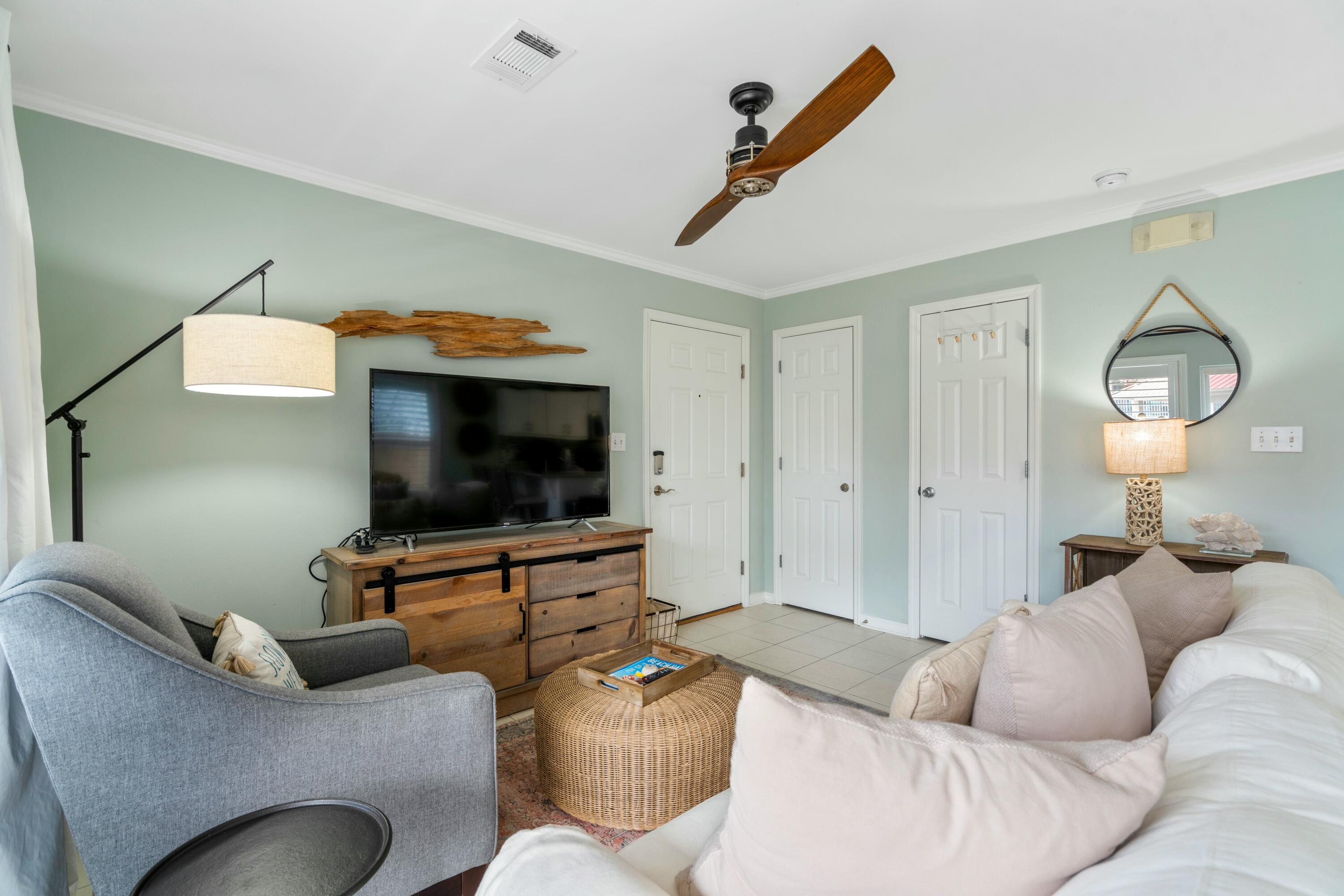 82 Sugar Sand Lane, Unit C1 Santa Rosa Beach, FL 32459 - Photo 3 of 29 a living room with furniture and a flat screen tv