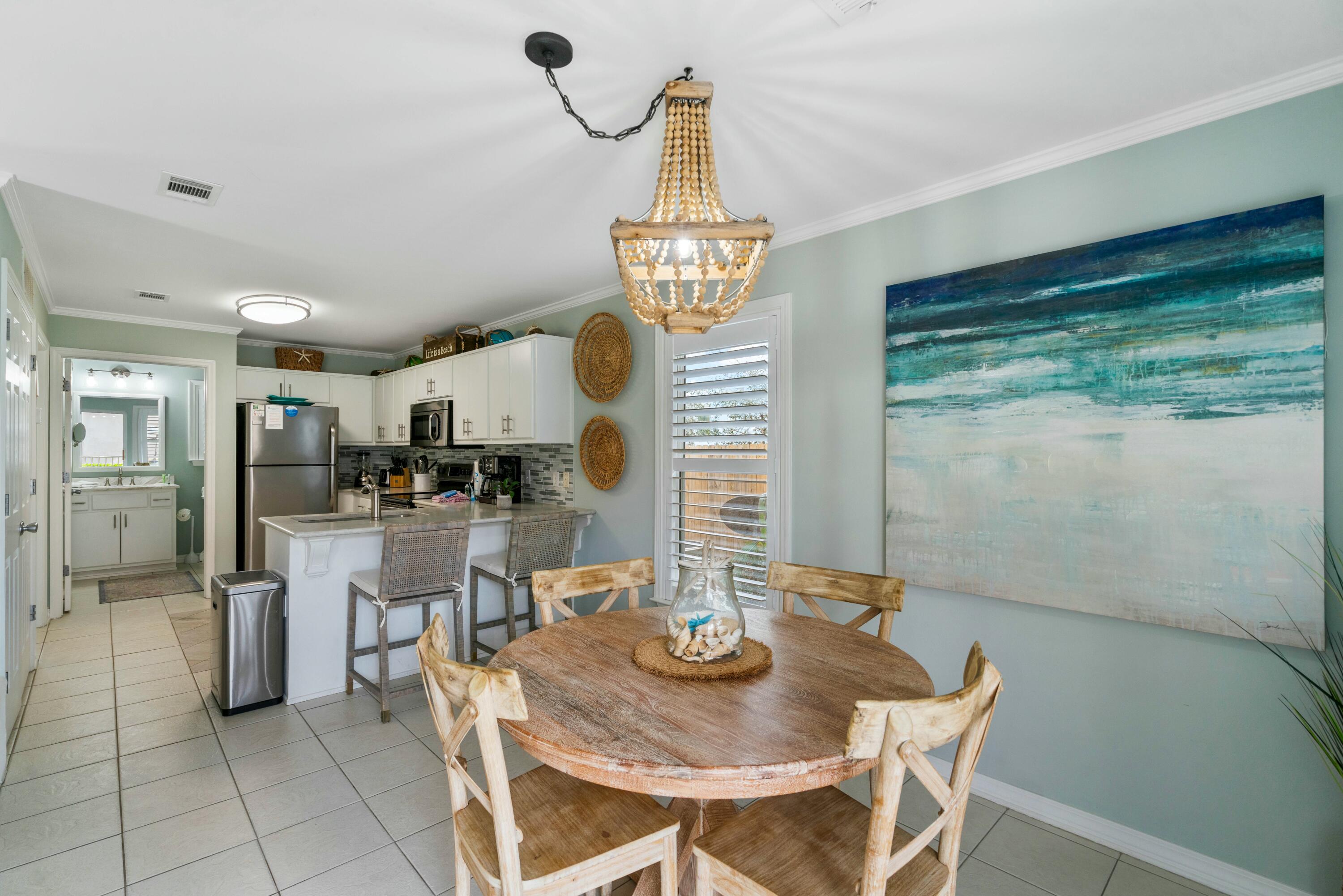 82 Sugar Sand Lane, Unit C1 Santa Rosa Beach, FL 32459 - Photo 6 of 29 a view of a dining room with furniture window and outside view