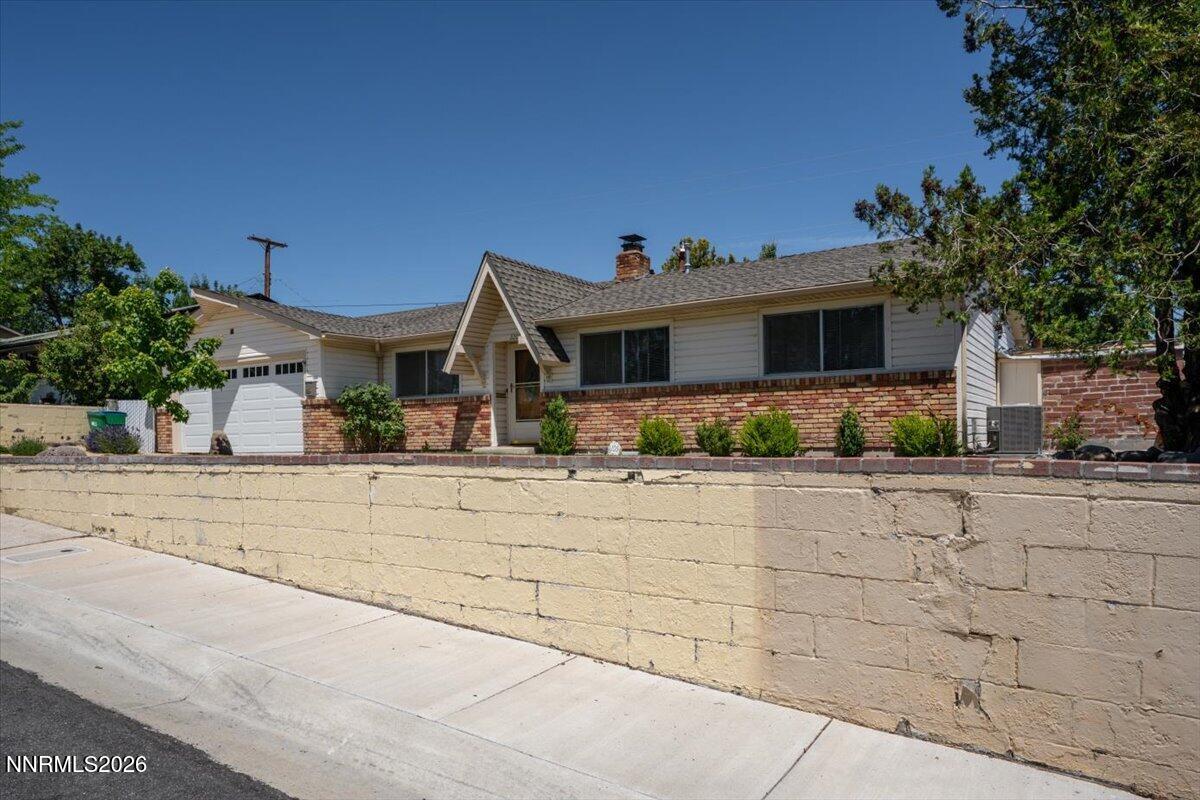 2205 Carlin Street Reno, NV 89503 - Photo 33 of 51 a front view of a house with yard