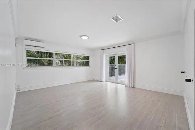 a bathroom with a granite countertop tub sink and mirror