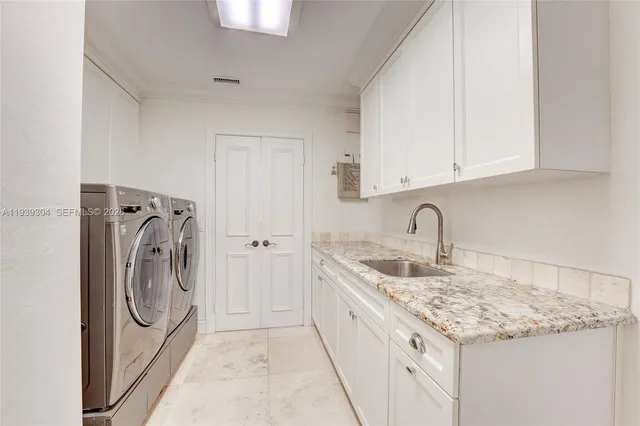 a bathroom with a granite countertop sink a mirror and a shower