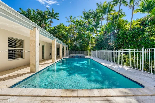 a view of a house with palm trees